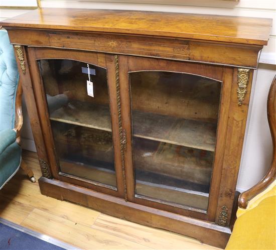 A Victorian inlaid walnut and gilt metal-mounted glazed display cabinet W.110cm